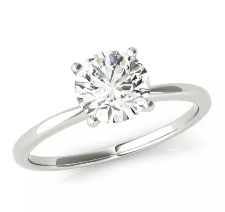 Round brilliant cut knife-edge solitaire sterling silver